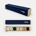 Navy 7-day pill organizer with sliding outer sleeve and seven-compartment tray